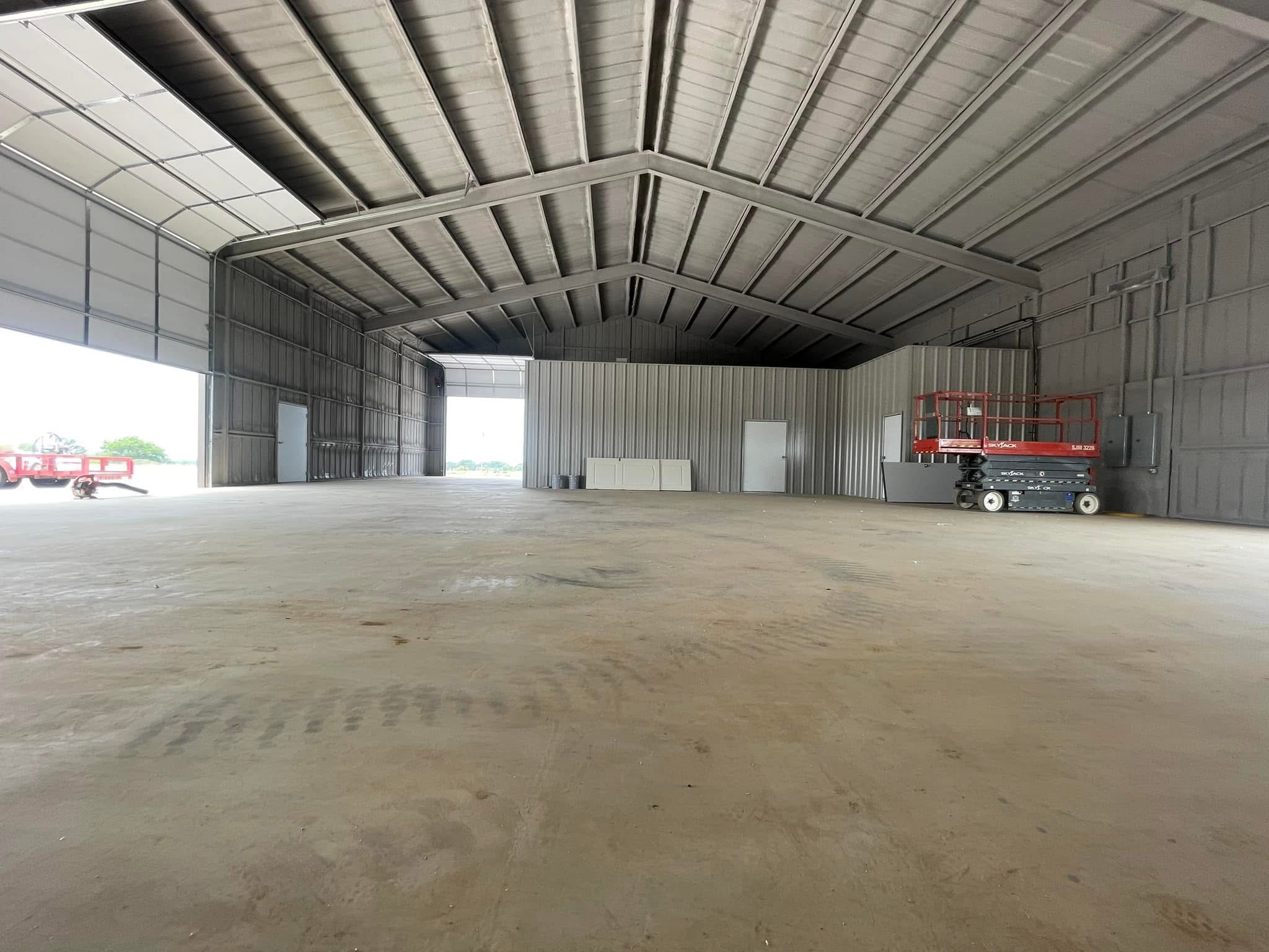 A large commercial metal building in Oklahoma before insulation — ready for professional spray foam application.