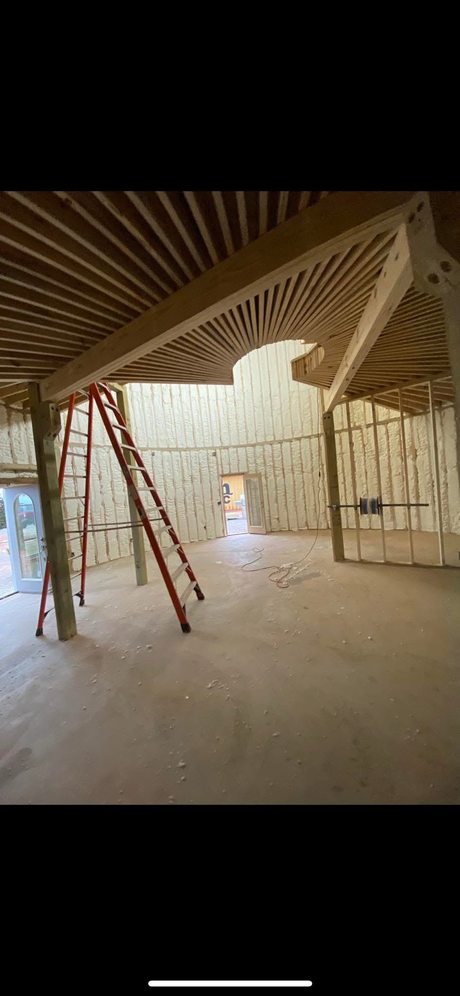 Open cell spray foam insulation on residential arched ceiling in new Oklahoma home