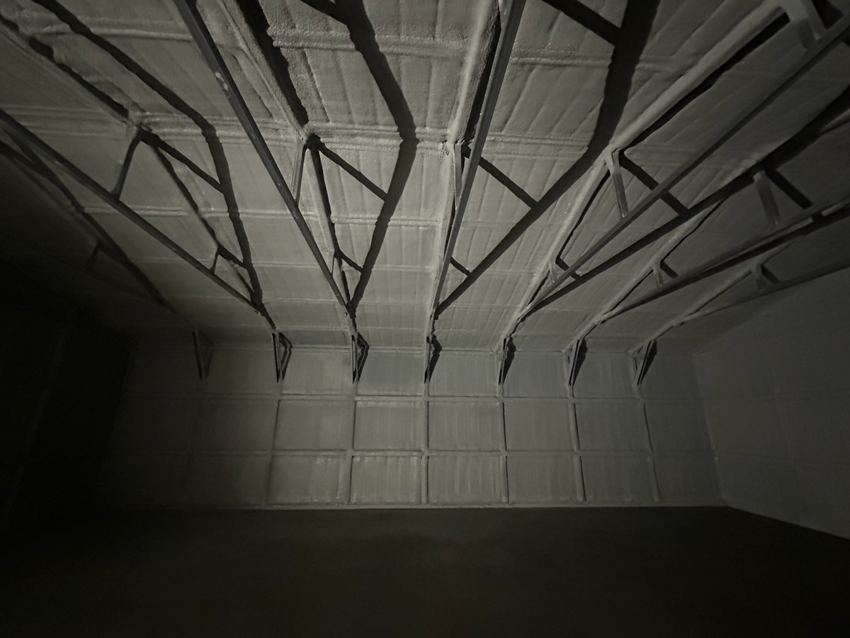 Pole barn interior with closed cell spray foam on walls and ceiling — temperature controlled year-round.