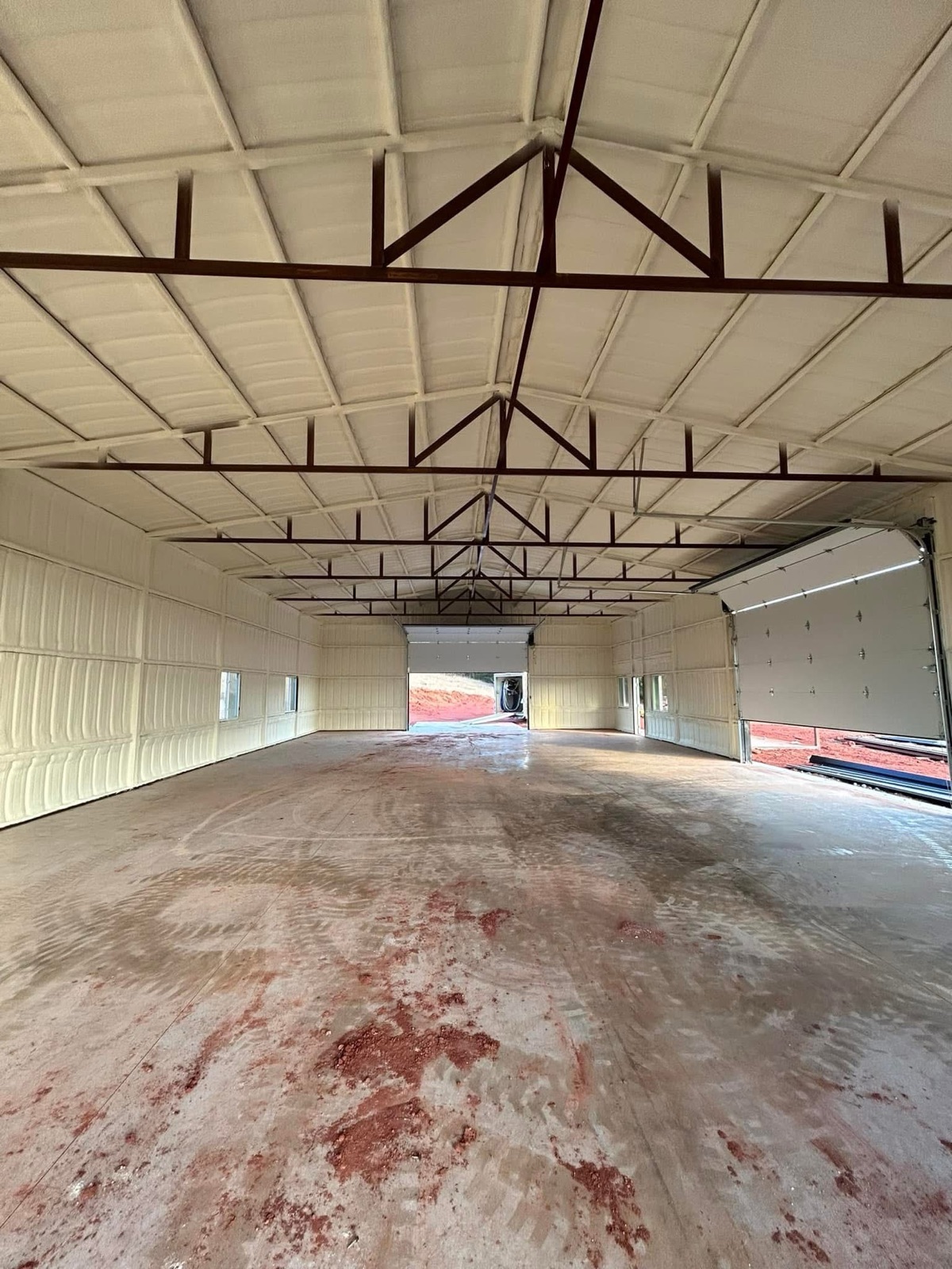 Large commercial building with closed cell spray foam applied to ceiling trusses and walls in Oklahoma.