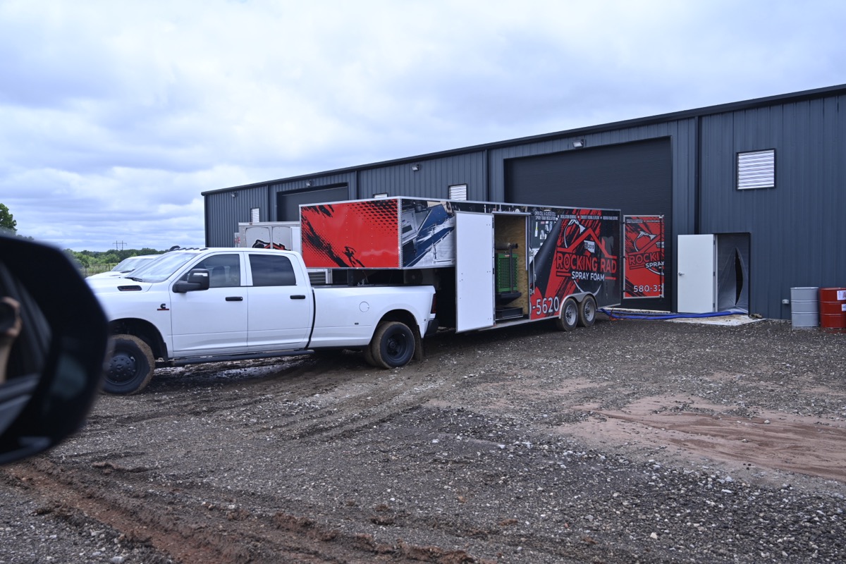 Rocking Rad Spray Foam truck and trailer at a job site in Oklahoma